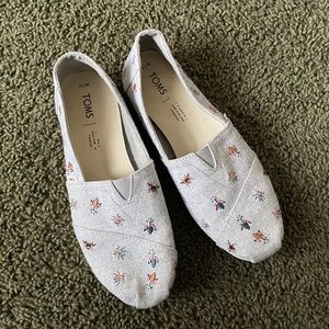 Toms with embroidered bugs